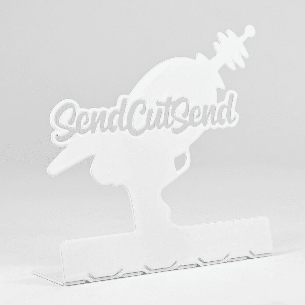 Image of a laser cut 316 stainless steel laser gun silhouette powder coated in white