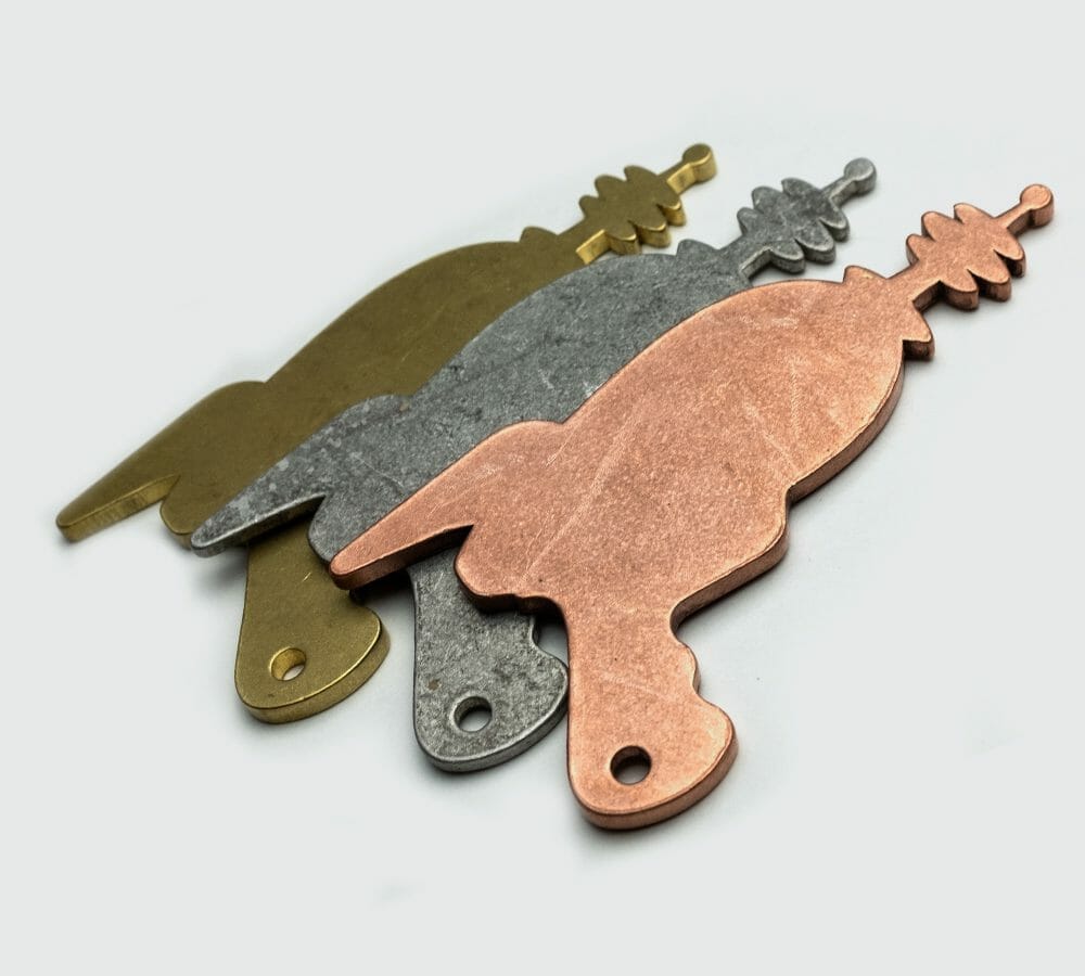 Examples of tumbled brass, aluminum, and copper parts.