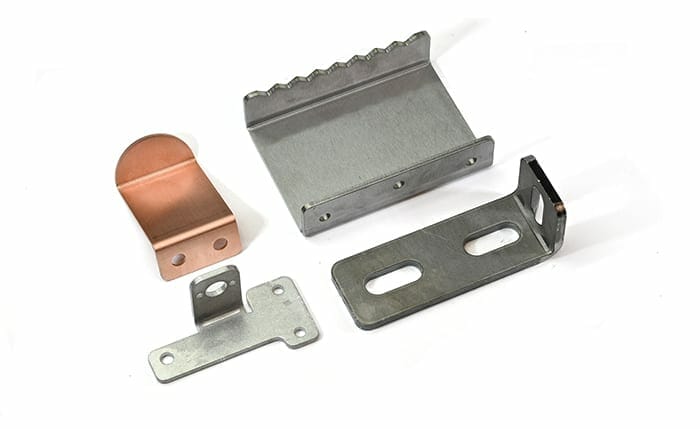 Four sheet metal bending examples in four different materials