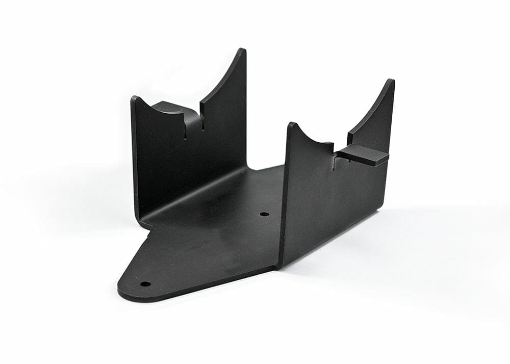 A bent metal part that has been powder coated black 