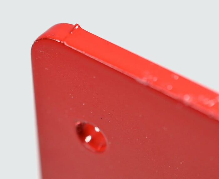 Micro tabs from the laser cutting process will show through the finish on powder coated parts.