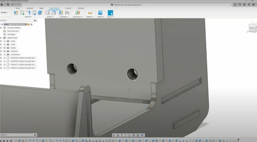 Screenshot of a part modeled in Fusion 360 with two 1/4-20 holes prepped for tapping
