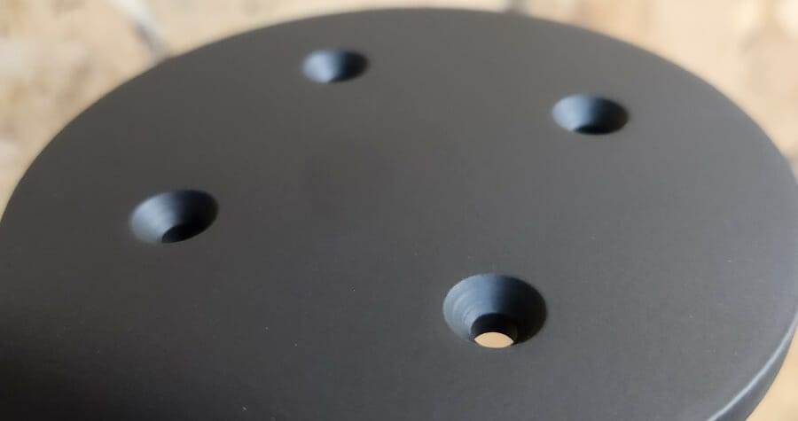 Powder coated part with countersinking