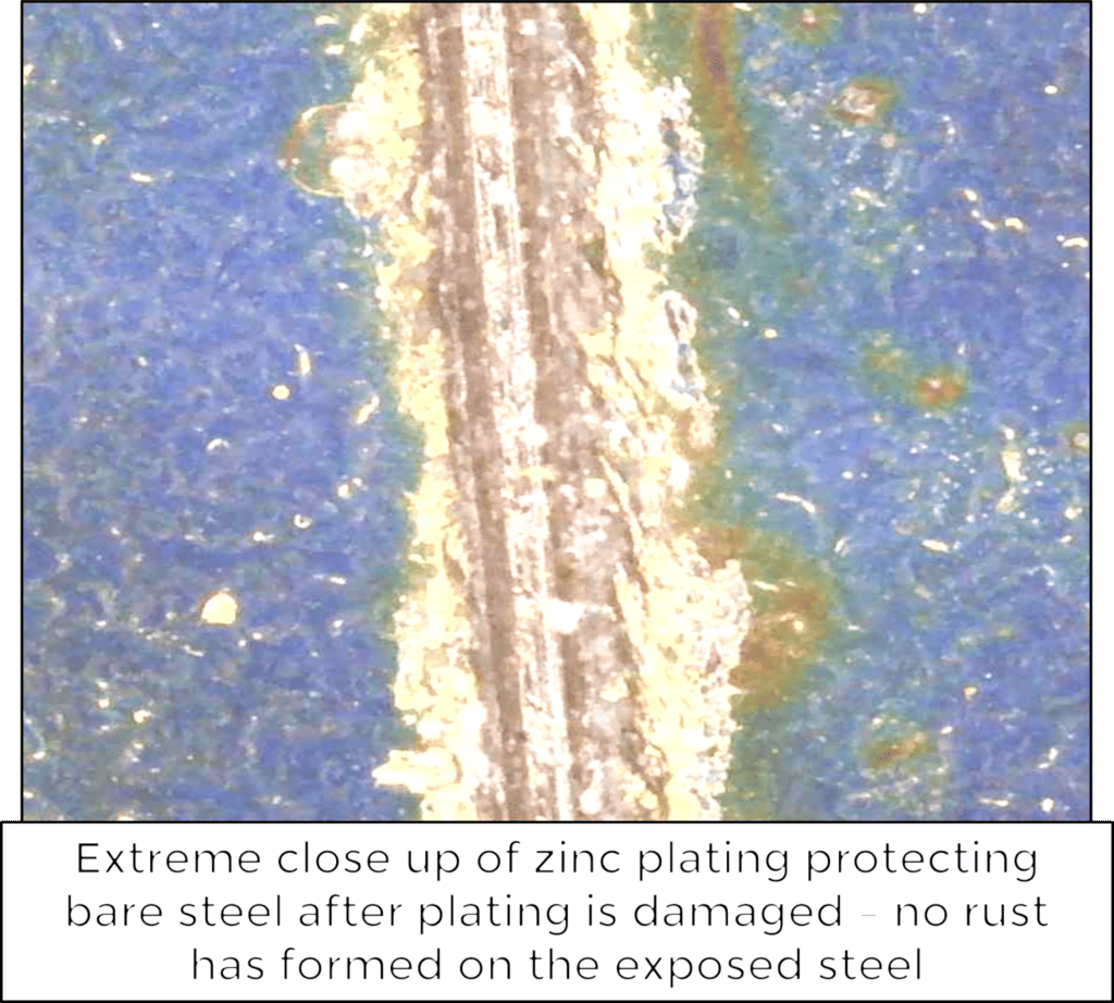 extreme close up of zinc plating protecting bare steel after plating is damaged